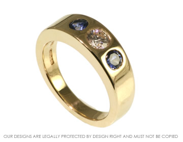 9ct yellow gold engagement ring with a 0.34ct diamond and 2 blue sapphire