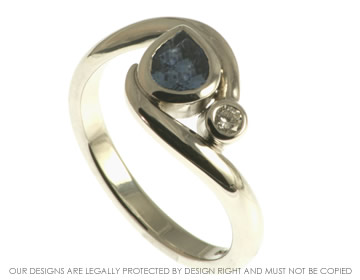 Platinum pear shape cornflower blue sapphire and HSI diamond engagement ring