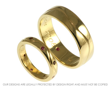 18ct yellow gold wedding bands with invisibly garnets and fushia pink sapphies.