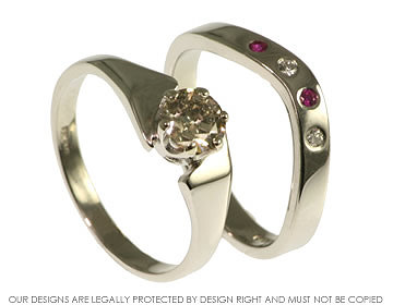 Fitted platinum eternity ring, with two brilliant cut diamonds and two rubies.