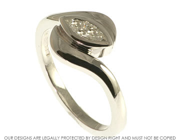 9ct white gold twist style engagement ring with marquise cut diamond.