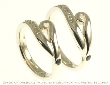 9ct white gold commitment rings using customer''s own diamonds and blue sapphires.