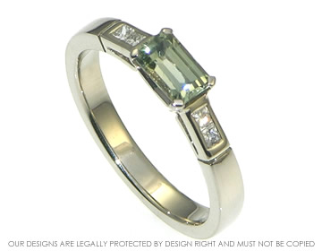 White gold emerald cut green sapphire and diamond engagement ring