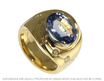 Dramatic whirlpool sapphire and dimond 18ct gold ring