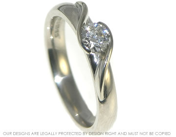 18ct white gold diamond engagement ring in a twist style design. 