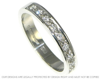 Platinum and diamond pave set half eternity ring