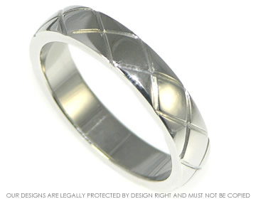 Platinum wedding band 4mm wide with engraved stylised kiss design