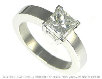 Platinum princess cut solitaire engagement ring.