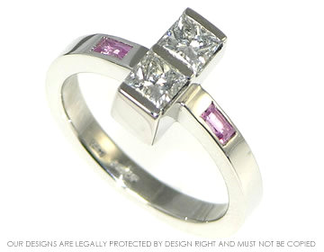 Platinum engagement ring with diamonds and pink sapphires. 