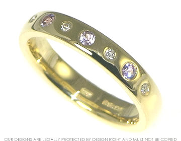 18ct yellow gold eternity ring with lilac sapphires and diamonds.