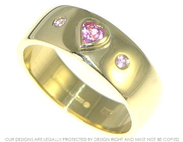 18ct yellow and white gold with a 0.31ct heart shaped sapphire 