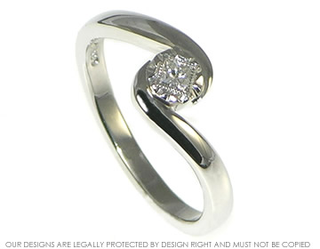 Delicate platinum twist engagement ring with a diamond in an antique feel