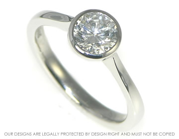 Platinum open tipped 0.79cts E SI1 diamond solitaire ring 