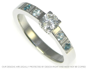 Platinum and 0.33cts diamond engagement ring with topaz details