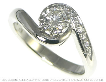 Platinum swirl engagement ring with a central 0.51ct H SI diamond. 