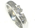 engagement ring with princess cut diamond and comet effect shoulders