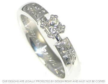 Engagement ring with princess cut diamond and comet effect shoulders.