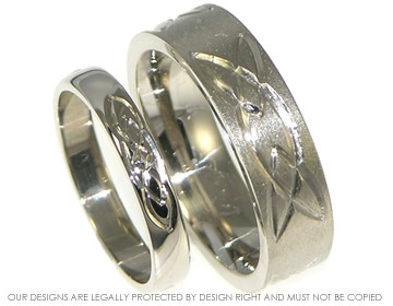 Bespoke 18ct white gold wedding rings with engraved Celtic knots.