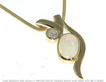 Bespoke 9ct yellow gold opal and diamond pednant.