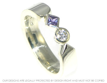 9ct white gold engagement ring with a diamond and a purple sapphire