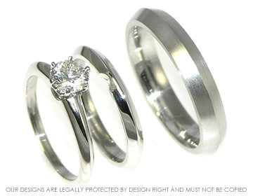 Pair of bespoke apex profile platinum wedding rings