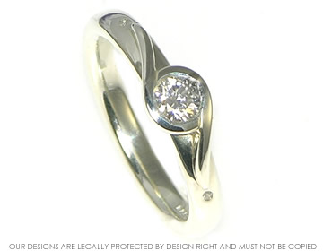 9ct white gold twist ring with a 0.25ct brilliant cut diamond