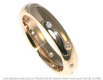 Bespoke 9ct rose gold eternity ring with scattered diamonds