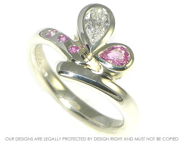 9ct white gold engagement ring with pear shaped diamond and pink sapphires 