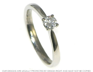 A palladium  0.21ct solitaire engagement ring.