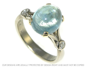 Aquamarine and diamond engagement ring inspired by the Eiffel tower.