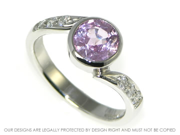 Platinum, 1.70ct pink sapphire and diamond engagement ring. 