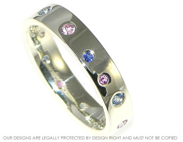 9ct white gold eternity ring with scattered pink and blue sapphires