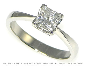 Platinum and princess cut diamond solitaire engagement ring