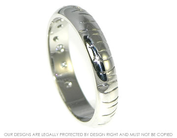 Bespoke platinum eternity ring with diamonds and engraved grass