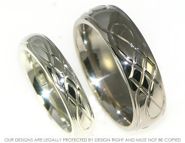 A pair of bespoke 18ct white gold celtic inspired wedding rings. 