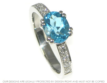 Sea and sky inspired platinum and topaz engagement ring