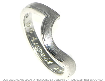 Bespoke white gold wedding band with engraved detailing and contrasting finishes