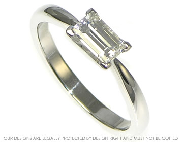 Art Deco style platinum 0.52 H-G SI-VS baguette diamond engagement ring.