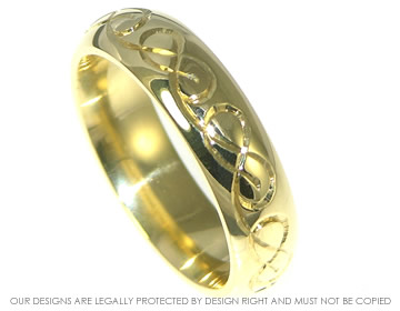 18ct yellow gold wedding band with Celtic knotwork hand engraved onto the surface