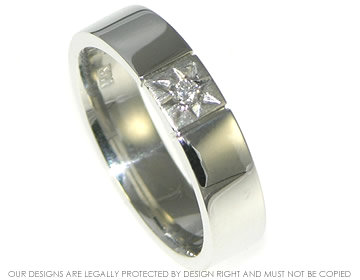 Platinum ring with a star set brilliant cut diamond