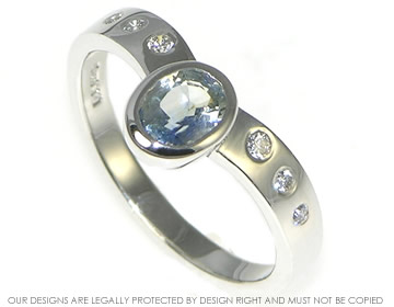 Wave inspired white gold and aqua sapphire engagement ring