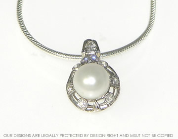 Platinum, diamond and pearl pendant adapted from customer''s dress ring.