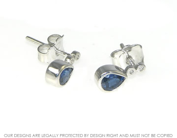 9ct white gold stud earrings with customers own stones.