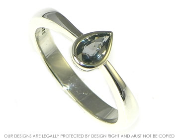 9ct white gold engagement ring with pear shape green sapphire.