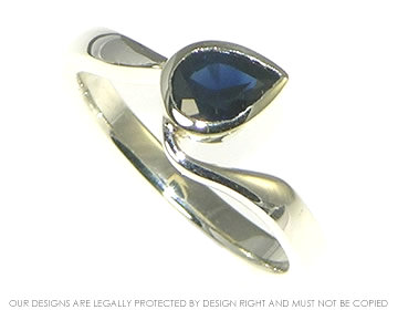 9ct white gold engagement ring incorporating customer's own  dark blue sapphire.