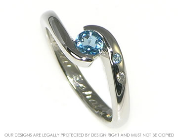 Commissioned platinum engagement ring with topaz and diamonds