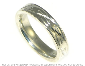 9ct white gold wedding ring with celtic engraving.