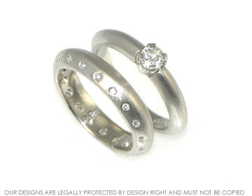 Bespoke platinum and diamond apex profile wedding ring.