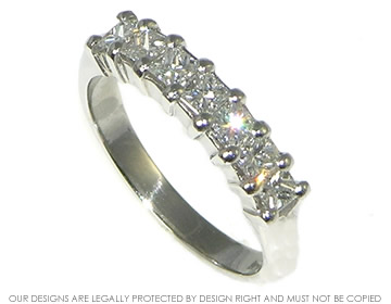 Platinum eternity ring with seven princess cut H SI diamonds totalling  0.60ct. 