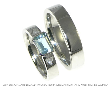 Platinum, aquamarine and diamond engagement ring and platinum wedding ring